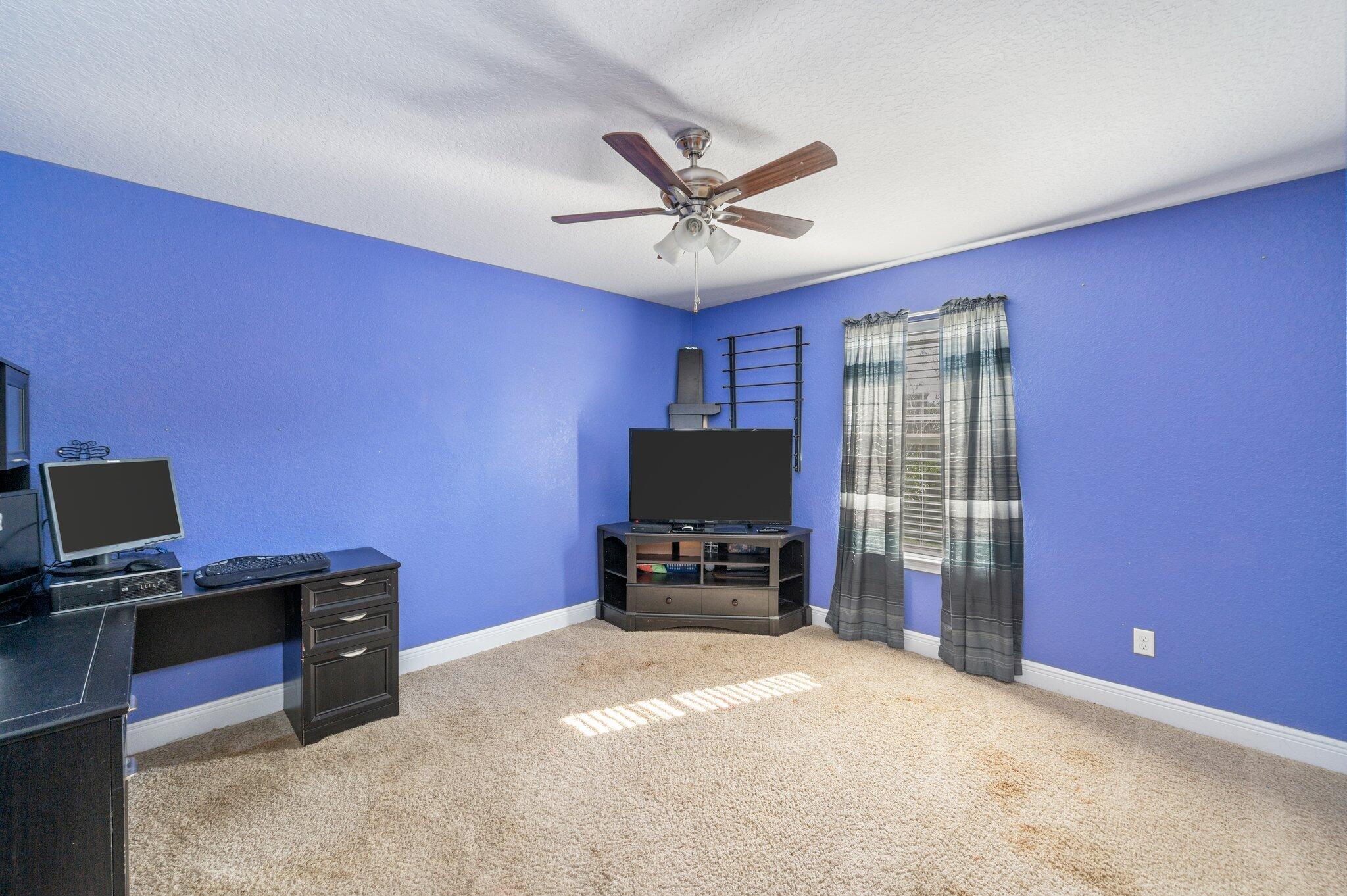 6262 Evan Circle Crestview, FL 32536 - Photo 37 of 45 a livingroom with workspace and a window