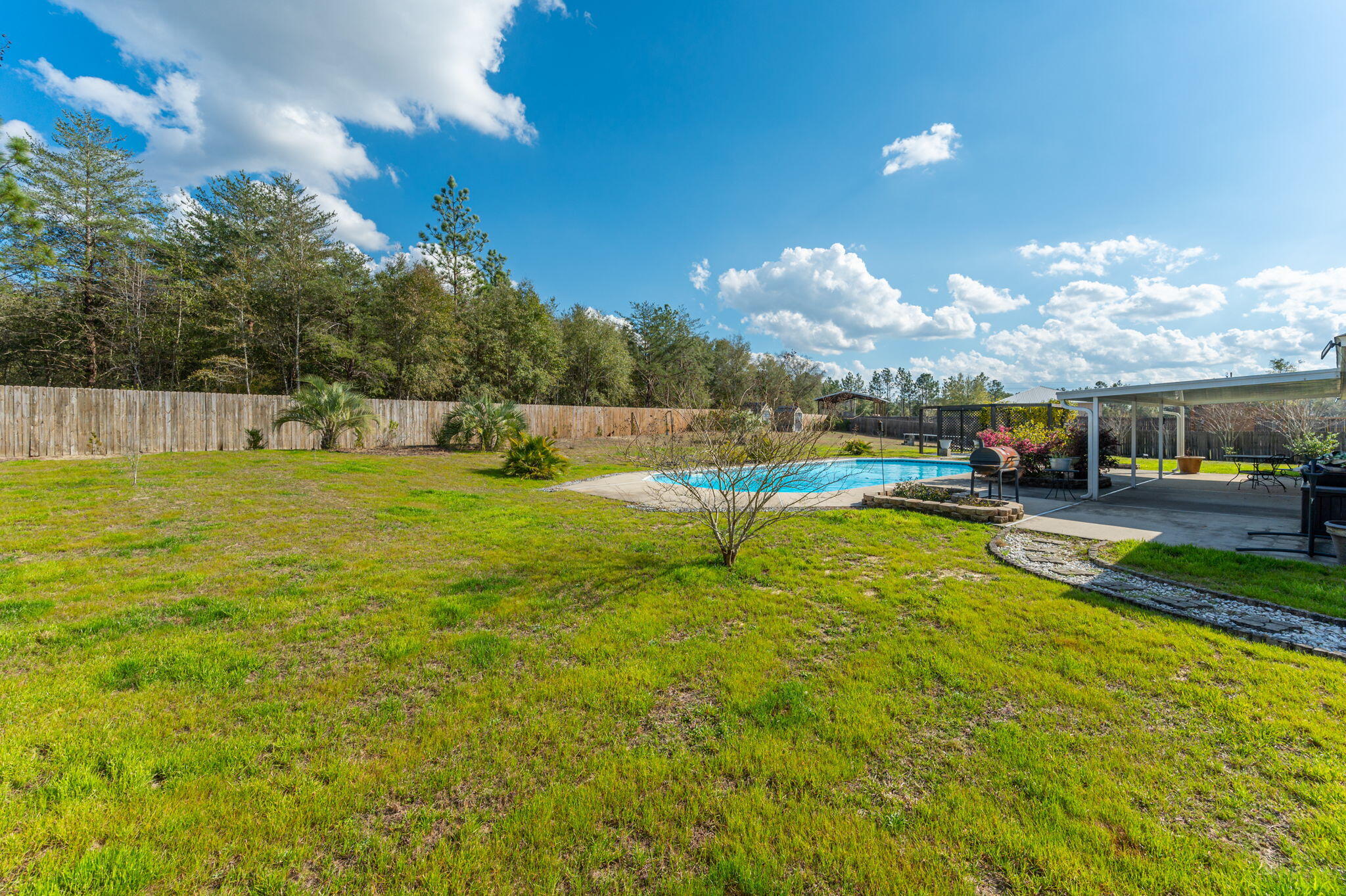 6262 Evan Circle Crestview, FL 32536 - Photo 41 of 45 a view of a swimming pool with a yard