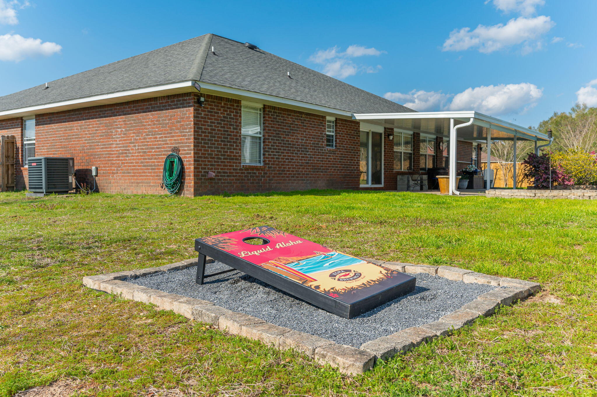 6262 Evan Circle Crestview, FL 32536 - Photo 42 of 45 a backyard of a house with barbeque oven table and chairs