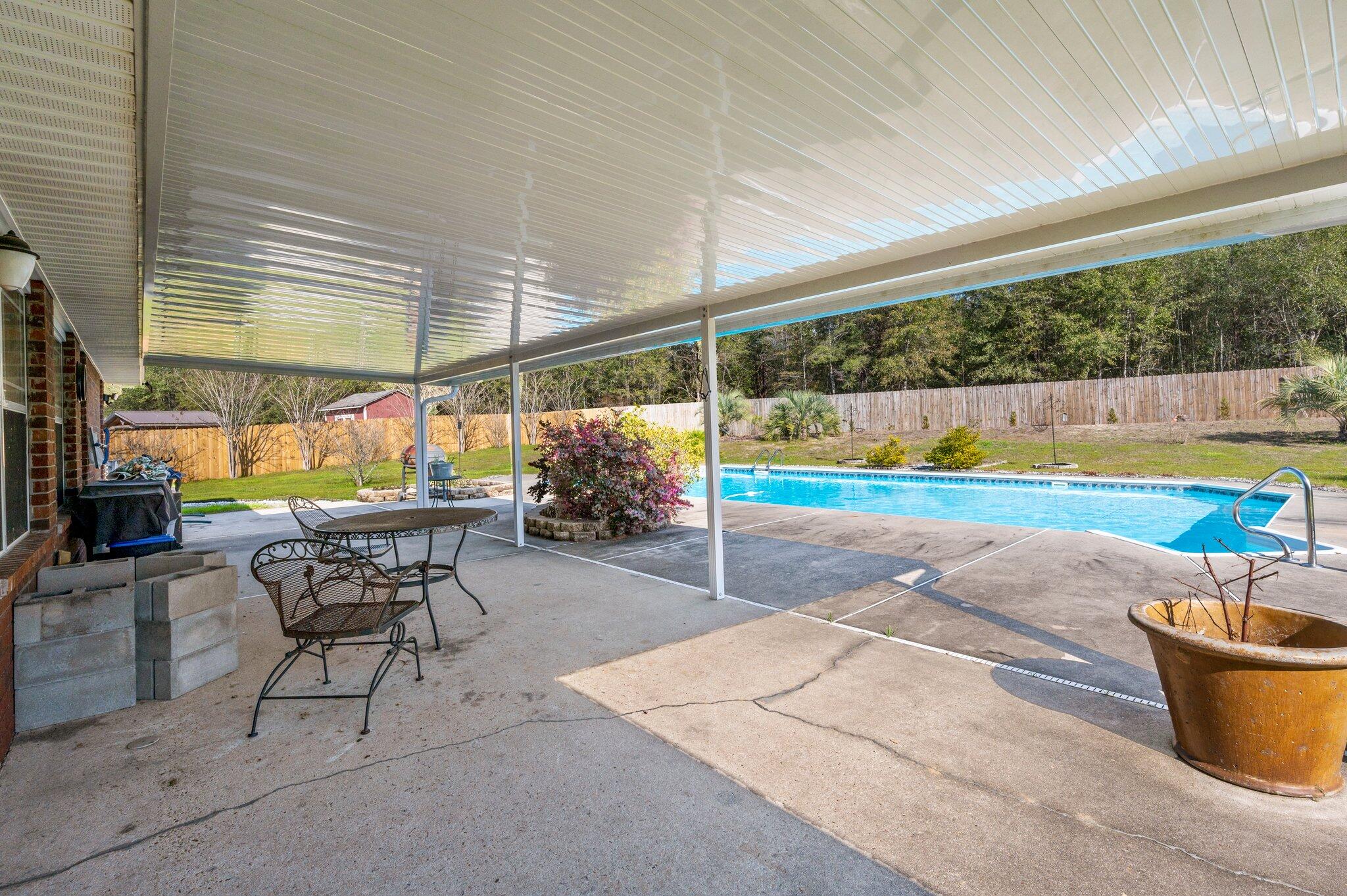 6262 Evan Circle Crestview, FL 32536 - Photo 44 of 45 a view of a patio with a table and chairs