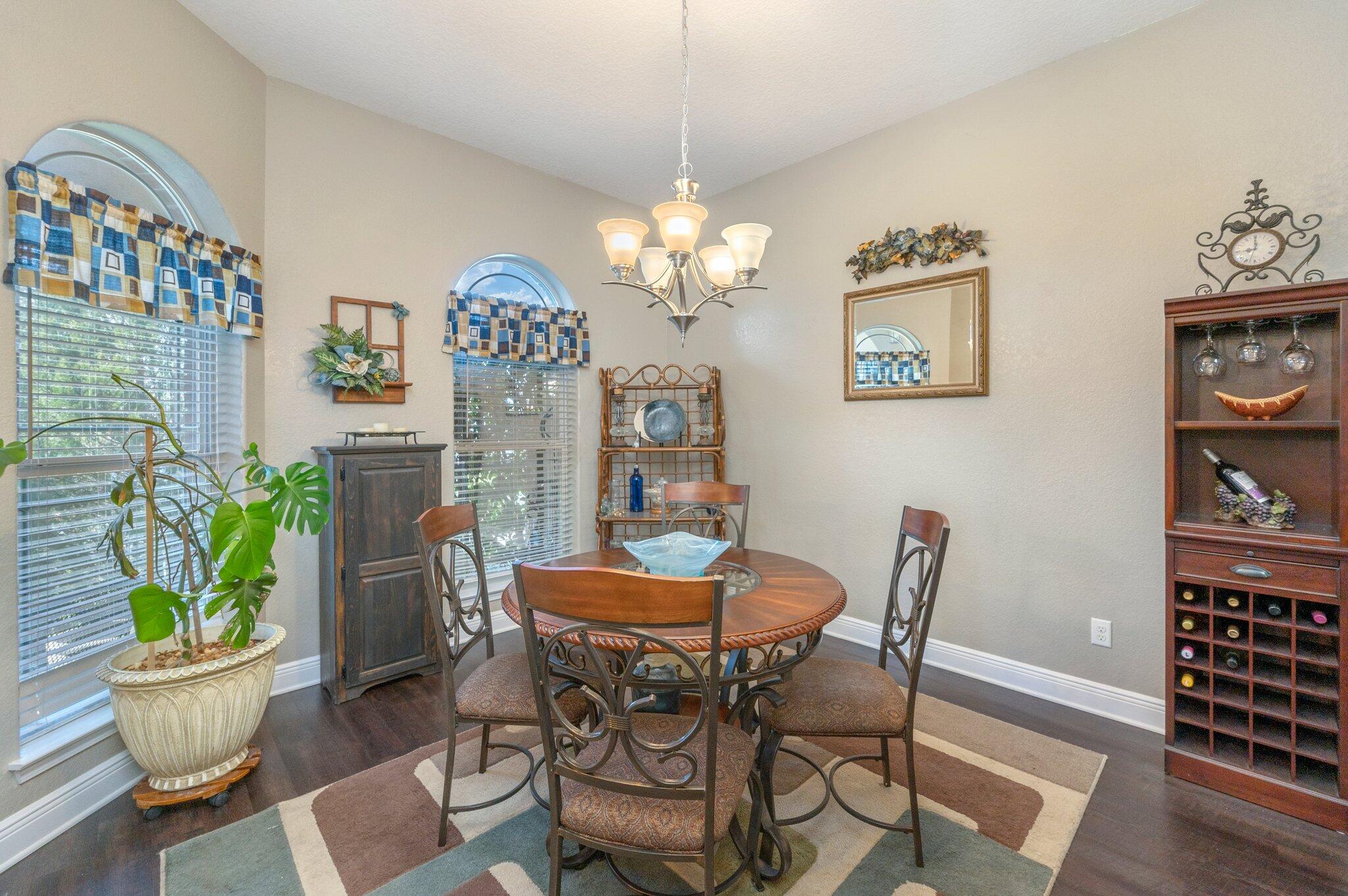 6262 Evan Circle Crestview, FL 32536 - Photo 8 of 45 a view of a dining room with furniture and chandelier