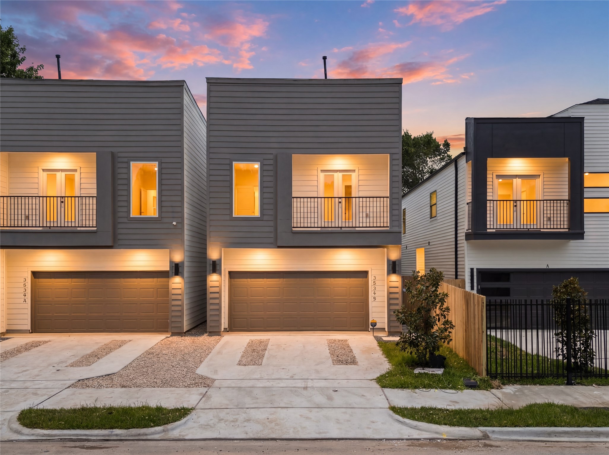 Evening elevation showcasing exterior lighting that elevates the home's curb appeal
