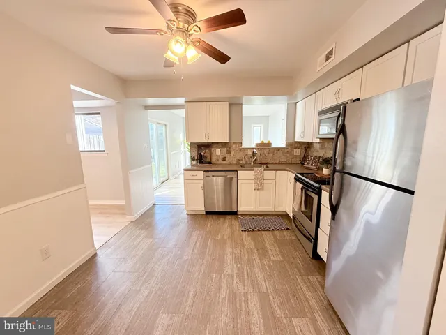 a kitchen with a refrigerator a sink and dishwasher