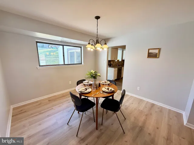 a view of a dining room with furniture and window