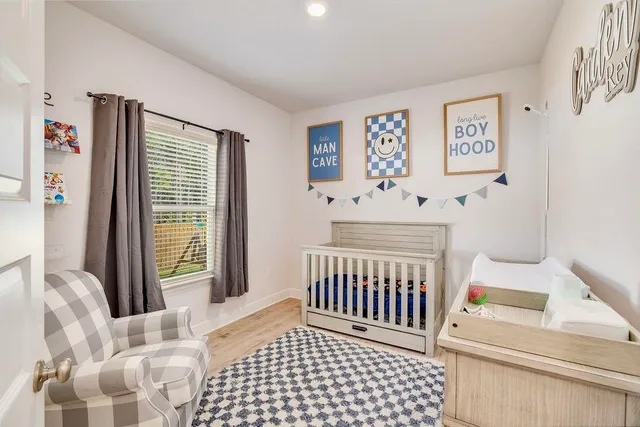 a bedroom with furniture and a window