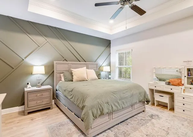 a bedroom with a bed and dresser