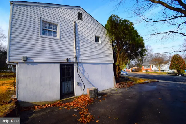 a view of a yard with a house in the background