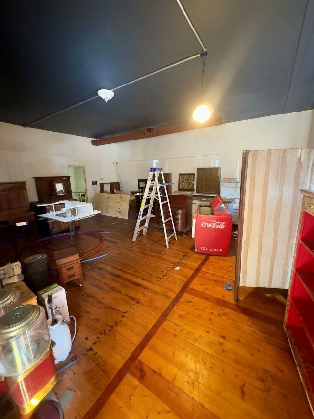 102 South Main Street Stockton, IL 61085 - Photo 2 of 6 a gym room with furniture and a flat screen tv