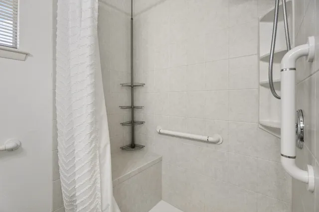 a bathroom with a shower and a toilet