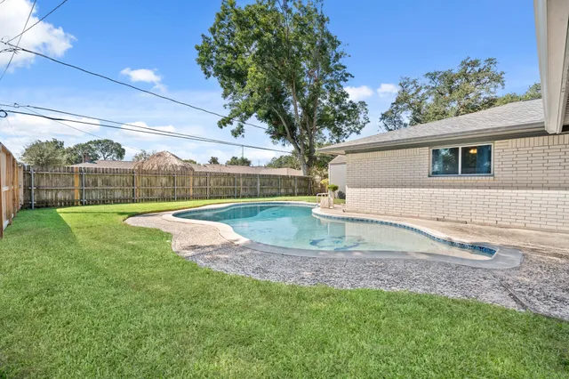 a view of a backyard with a garden and plants
