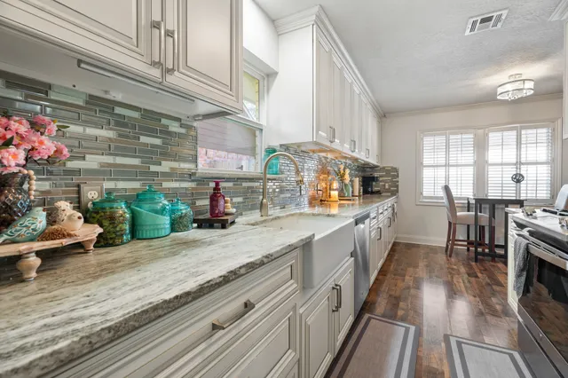 a kitchen with granite countertop lots of counter top space
