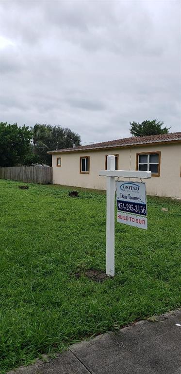 4430 Southwest 57th Avenue Davie, FL 33314 - Photo 3 of 3 a sign board with a house in the background