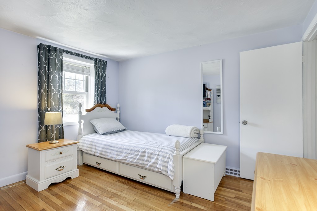 13 Cypress Road Natick, MA 01760 - Photo 5 of 24 a bedroom with a bed and wooden floor