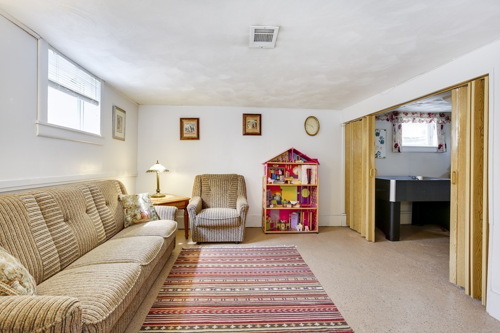 13 Cypress Road Natick, MA 01760 - Photo 8 of 24 a living room with furniture and a flat screen tv