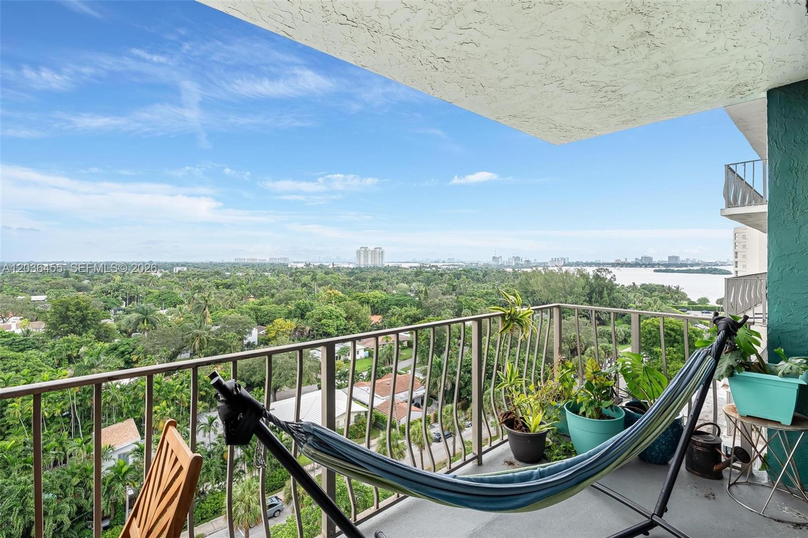 780 Northeast 69th Street, Unit 1010 Miami, FL 33138 - Photo 19 of 31 a view of a balcony with wooden floor and fence