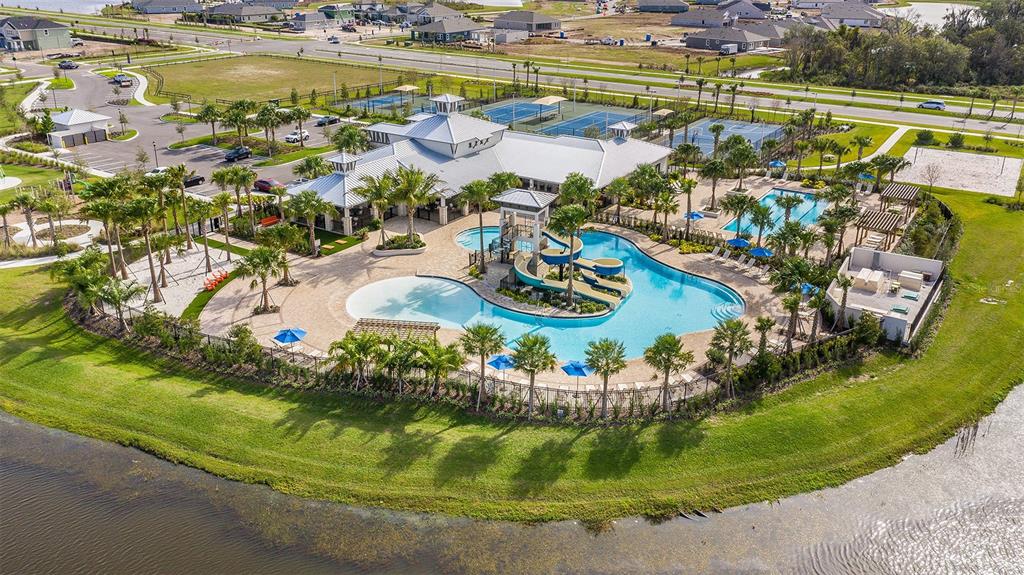 5129 Spring Maiden Circle Apollo Beach, FL 33572 - Photo 12 of 17 a view of a swimming pool a yard and outdoor seating