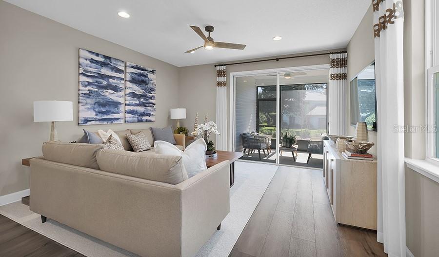 5129 Spring Maiden Circle Apollo Beach, FL 33572 - Photo 5 of 17 a living room with furniture and a large window