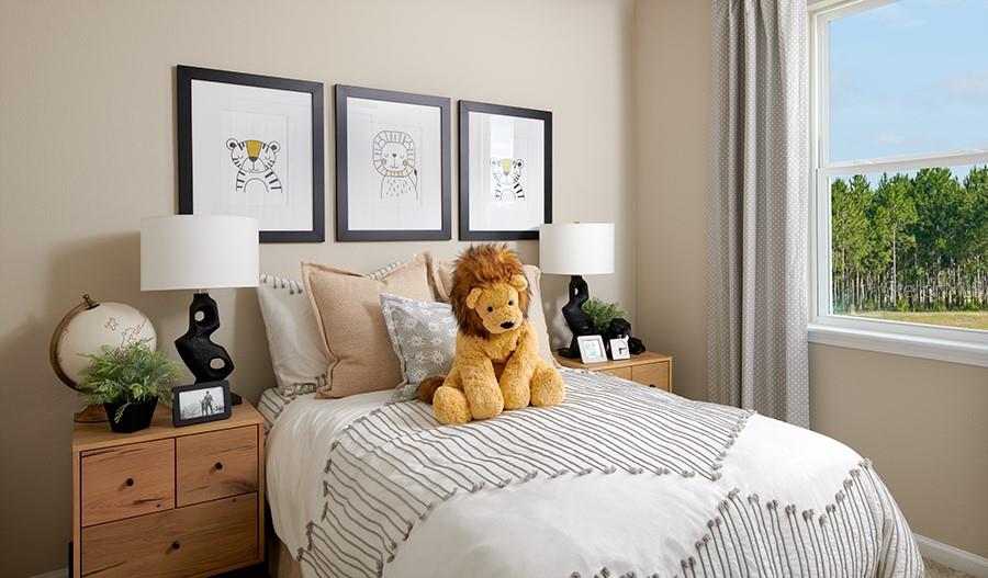 5129 Spring Maiden Circle Apollo Beach, FL 33572 - Photo 8 of 17 a bedroom with a bed and a window