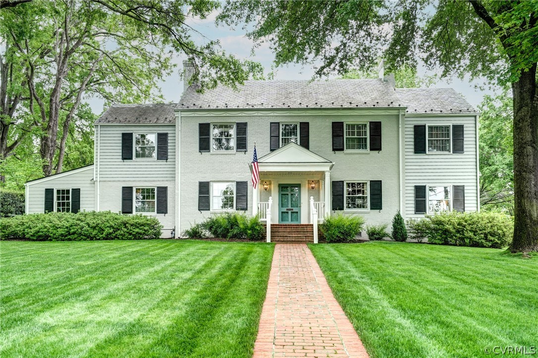 a front view of a house with a yard