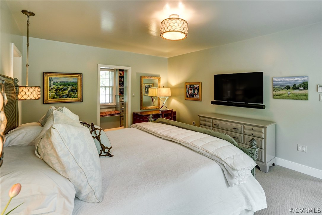 115 South Wilton Road Richmond, VA 23226 - Photo 21 of 33 a bedroom with a bed and a flat screen tv