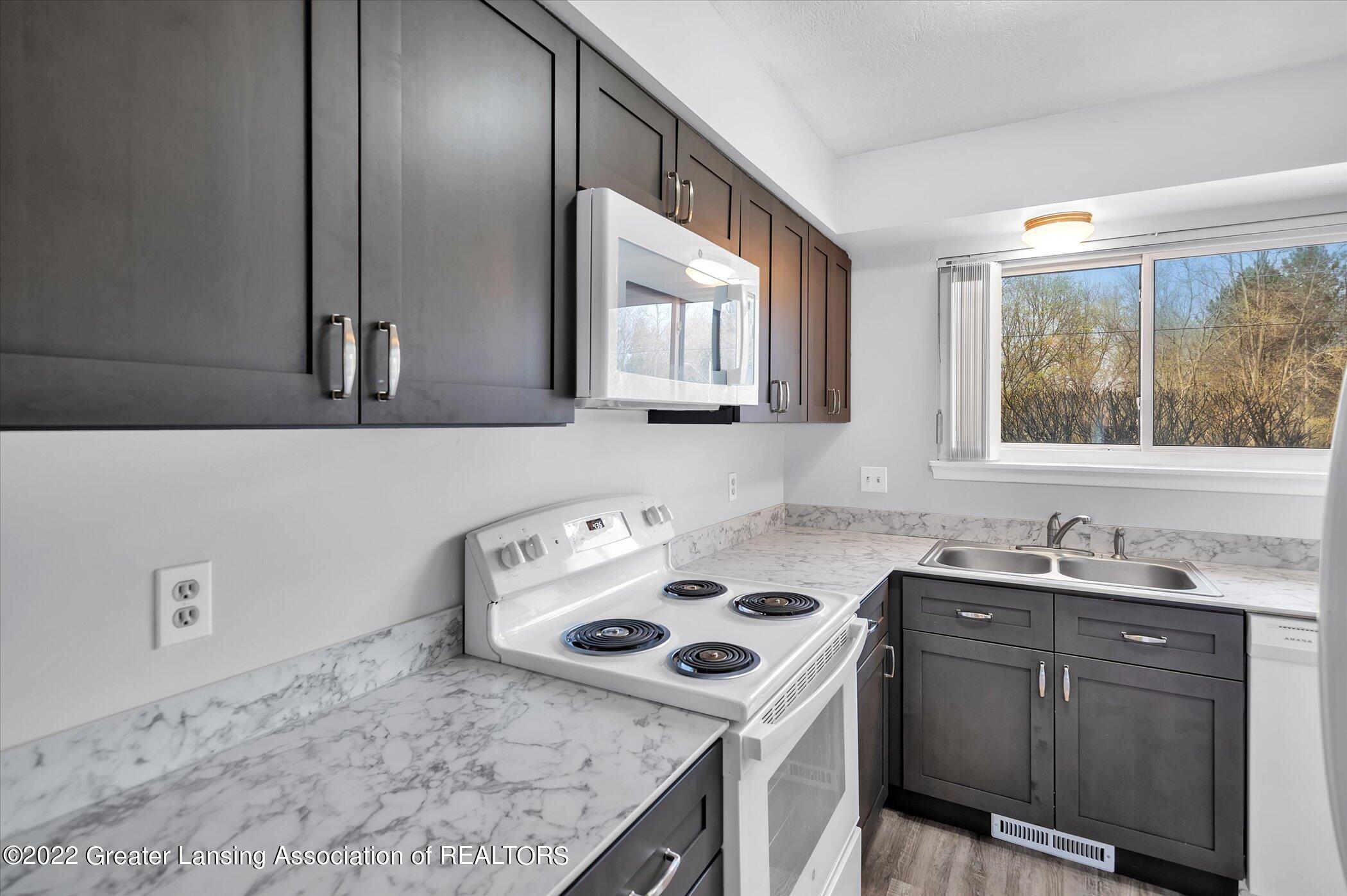 2085 East Lake Lansing Road Haslett, MI 48840 - Photo 12 of 22 12-2085-Lake-Lansing-Rd-WindowStill-Real