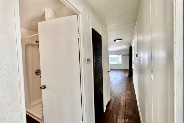 a view of a bathroom from a hallway
