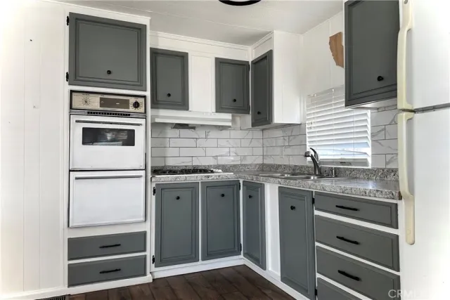 a kitchen with stainless steel appliances a stove and a refrigerator