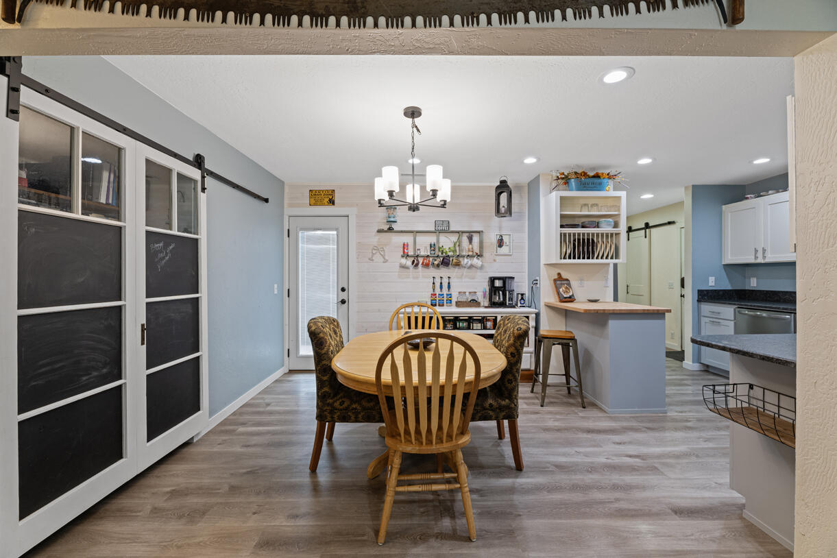 3747 Hilsinger Road Phoenix, OR 97535 - Photo 13 of 34 a view of a dining room with furniture and wooden floor
