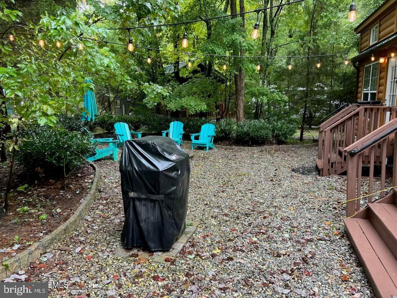 724 Monmouth Road, Unit 14 Cream Ridge, NJ 08514 - Photo 21 of 25 a view of a chairs and table in the backyard