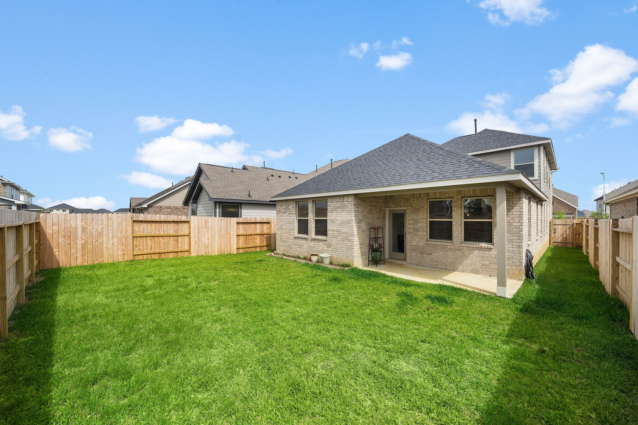 31203 Balsam Hawk Lane Hockley, TX 77447 - Photo 19 of 19 a front view of a house with a yard and porch