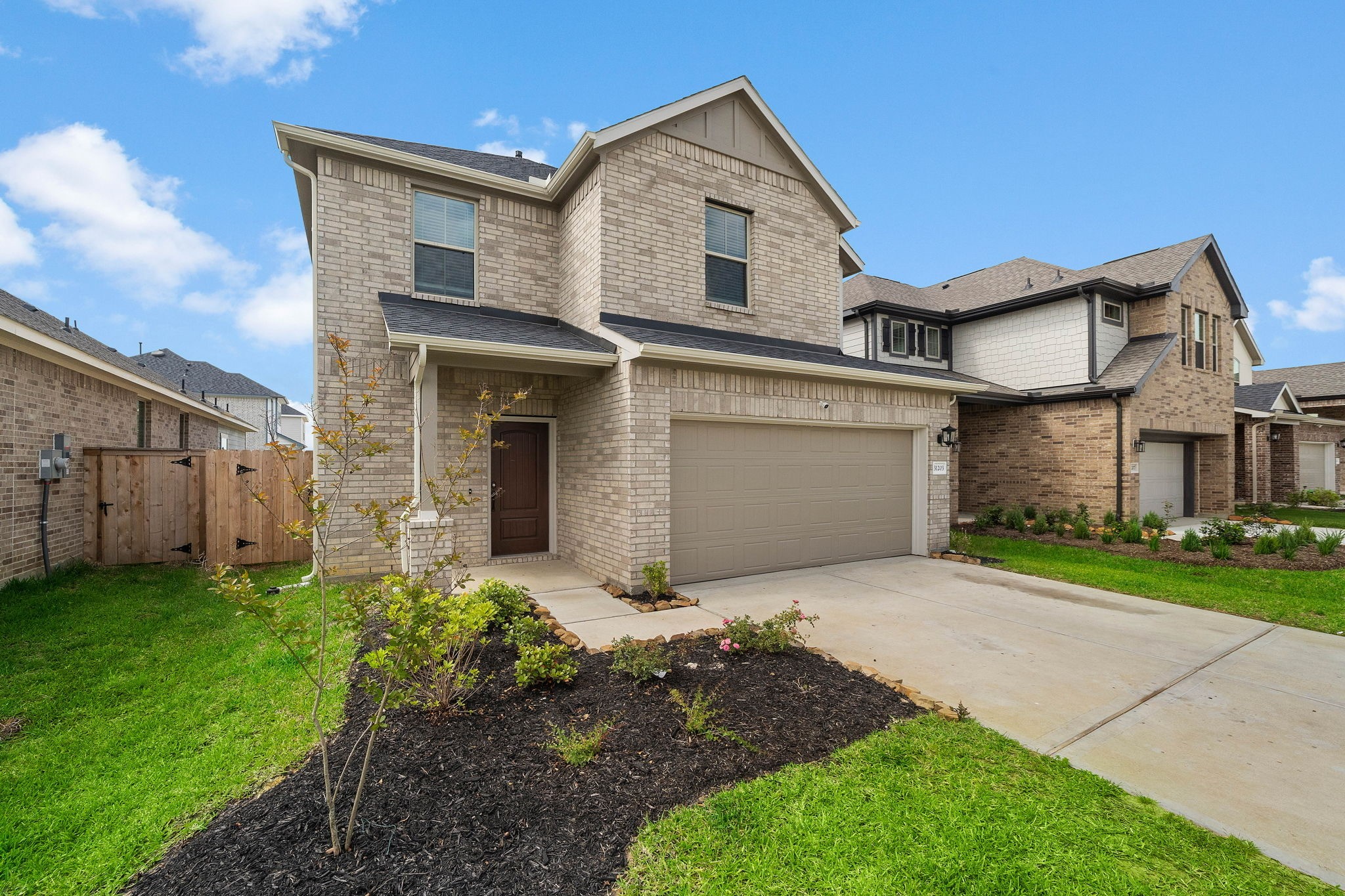 31203 Balsam Hawk Lane Hockley, TX 77447 - Photo 2 of 19 a front view of a house with a yard and garage