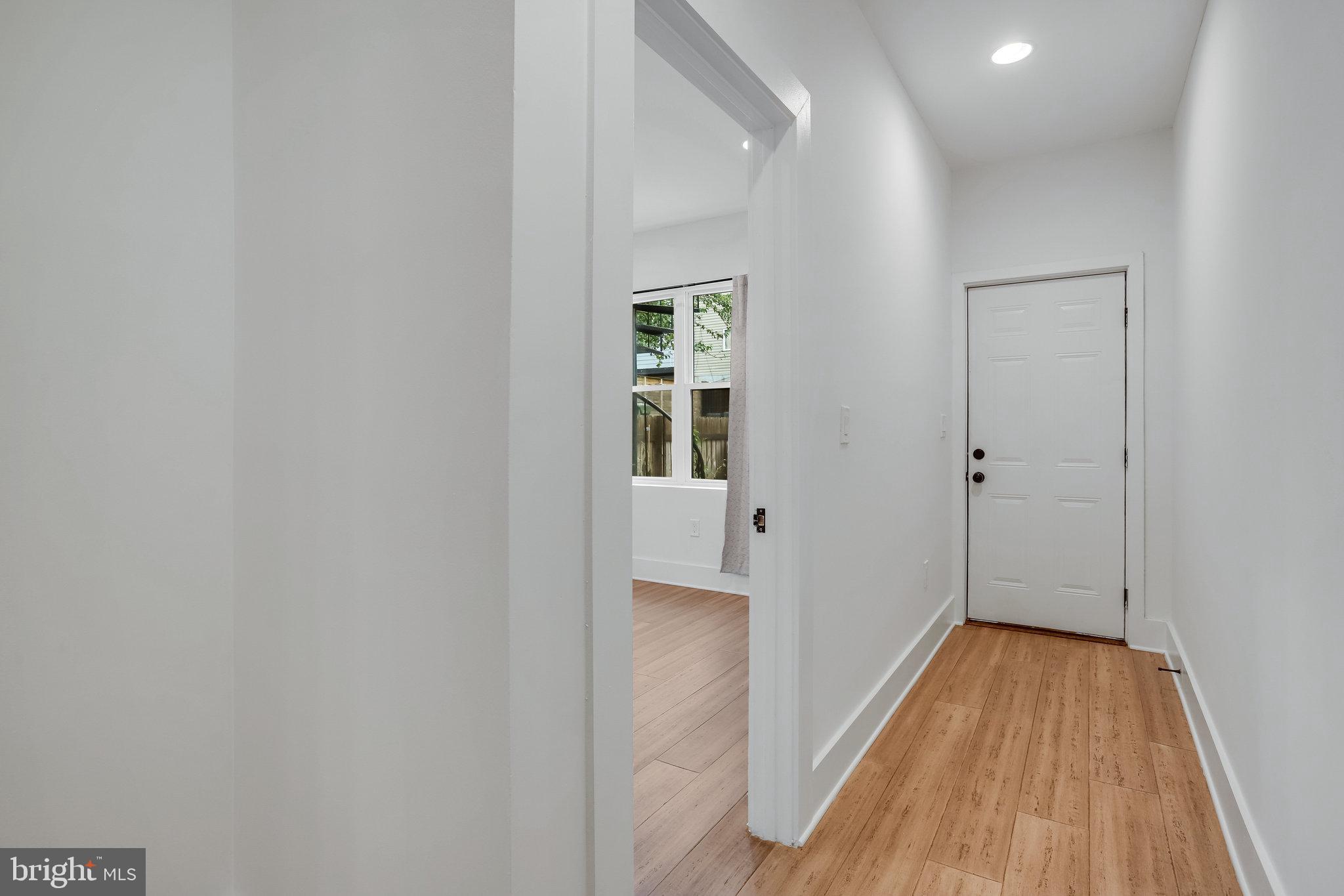 1225 Raum Street Northeast, Unit 1 Washington, DC 20002 - Photo 8 of 22 Hallway To Rear Entrance and 2nd Bedroom