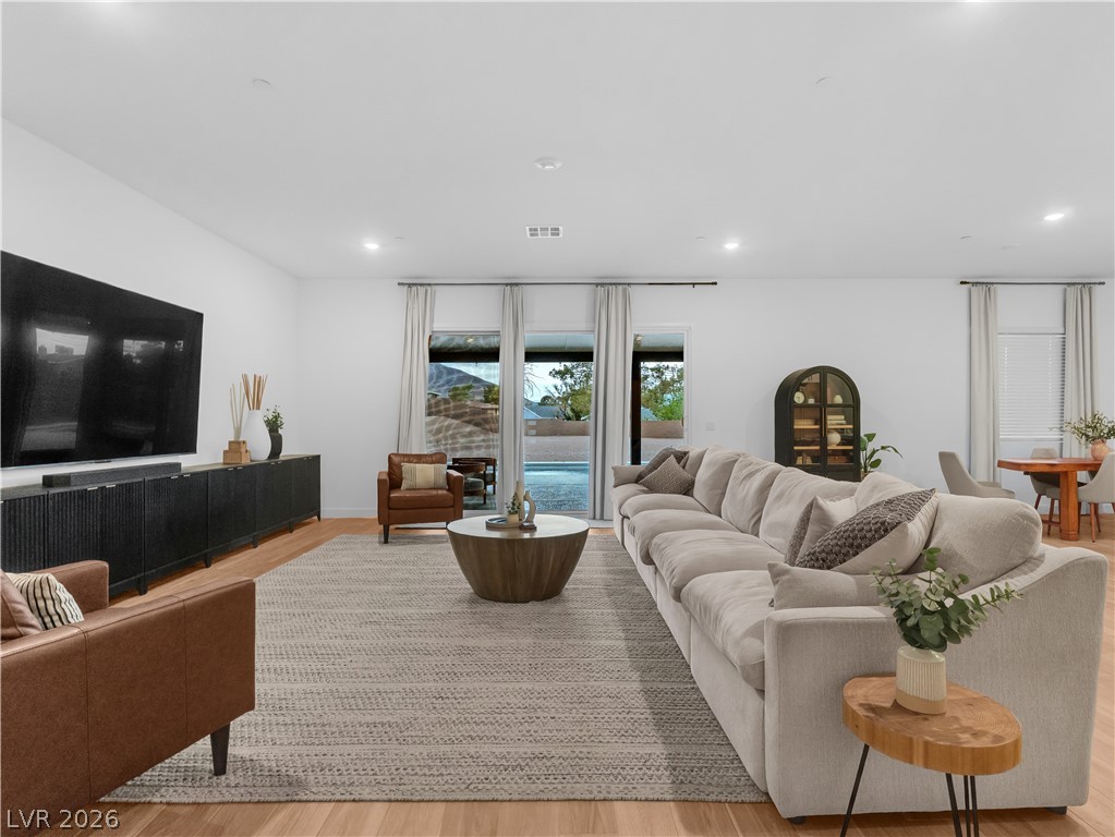 153 Montevallo Bnd Street Henderson, NV 89015 - Photo 20 of 65 Living area featuring light wood-type flooring and recessed lighting