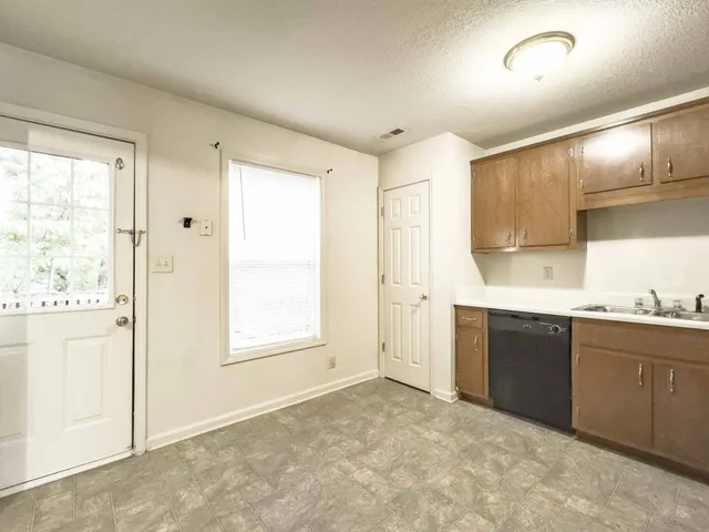 a view of a kitchen with electric appliances