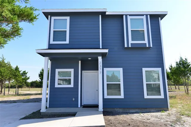 a view of a house with wooden floor and a potted plant