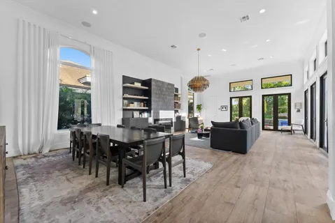 a living room with furniture a rug and a window