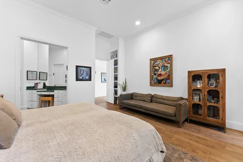 a bedroom with two beds and painted walls