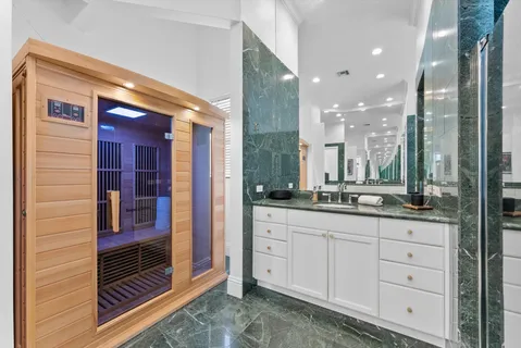 a bedroom with a bed and a couch