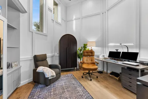 a bed room with a bed and a chair