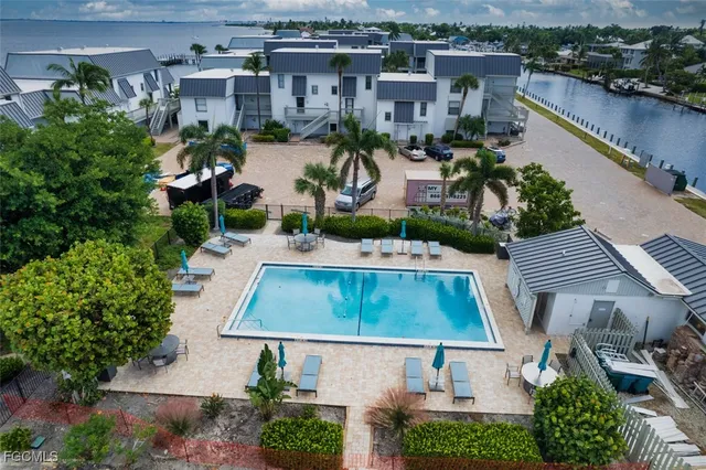 an aerial view of a house with a swimming pool