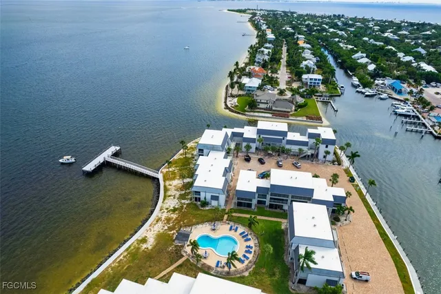 an aerial view of a house with a lake view