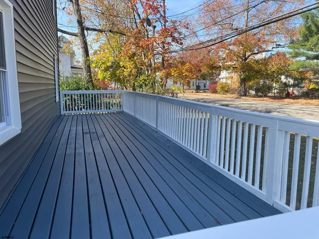 a view of balcony with wooden floor