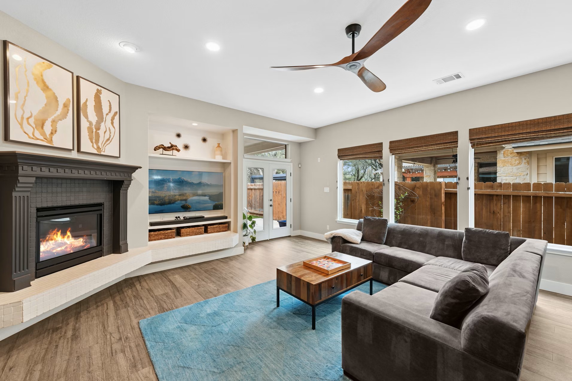 320 El Socorro Lane Austin, TX 78732 - Photo 2 of 40 a living room with furniture fireplace and flat screen tv