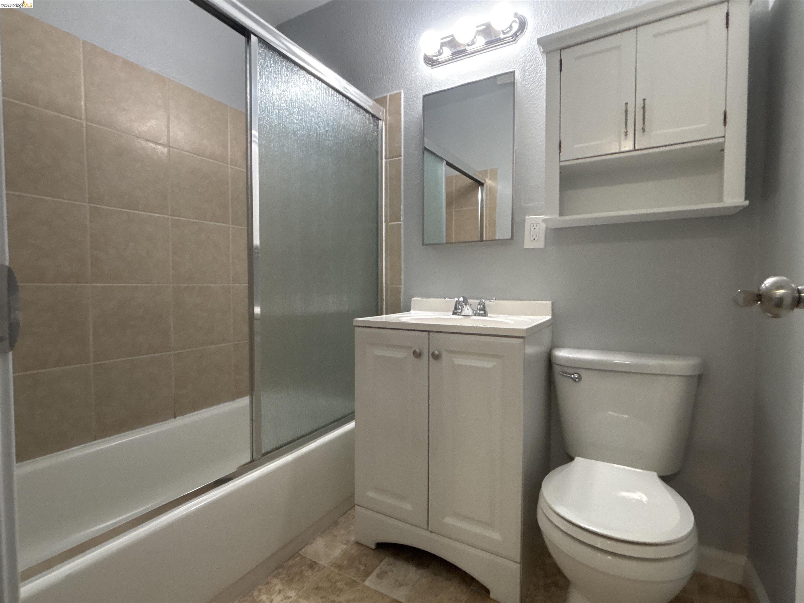 4462 Clayton Road, Unit A Concord, CA 94521 - Photo 8 of 11 a bathroom with a sink a toilet and shower