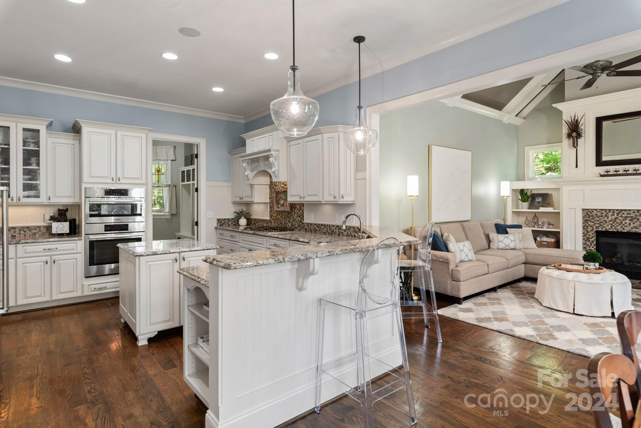 238 Horton Grove Road Fort Mill, SC 29715 - Photo 11 of 47 a large kitchen with white cabinets and wooden floor