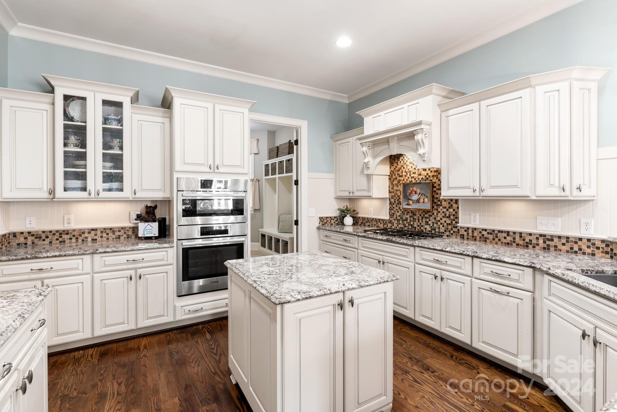 238 Horton Grove Road Fort Mill, SC 29715 - Photo 12 of 47 a kitchen with granite countertop white cabinets and white appliances