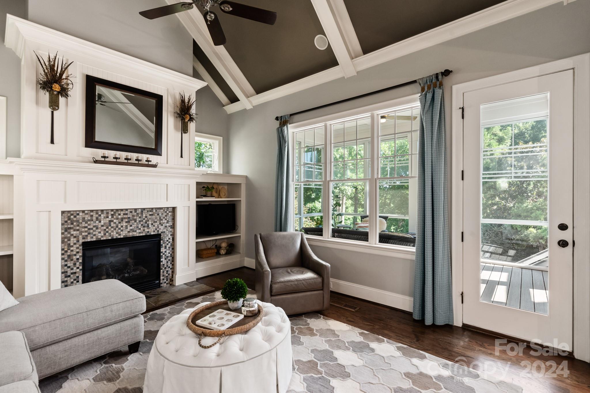 238 Horton Grove Road Fort Mill, SC 29715 - Photo 15 of 47 a living room with furniture a fireplace and a flat screen tv