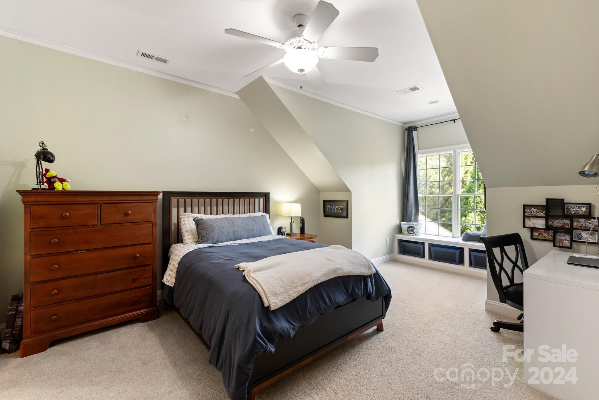 238 Horton Grove Road Fort Mill, SC 29715 - Photo 20 of 47 a spacious bedroom with a bed a table and large windows
