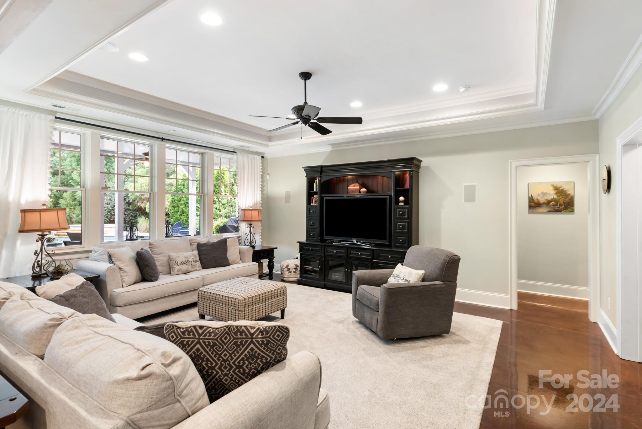 238 Horton Grove Road Fort Mill, SC 29715 - Photo 29 of 47 a living room with furniture a large window and a flat screen tv