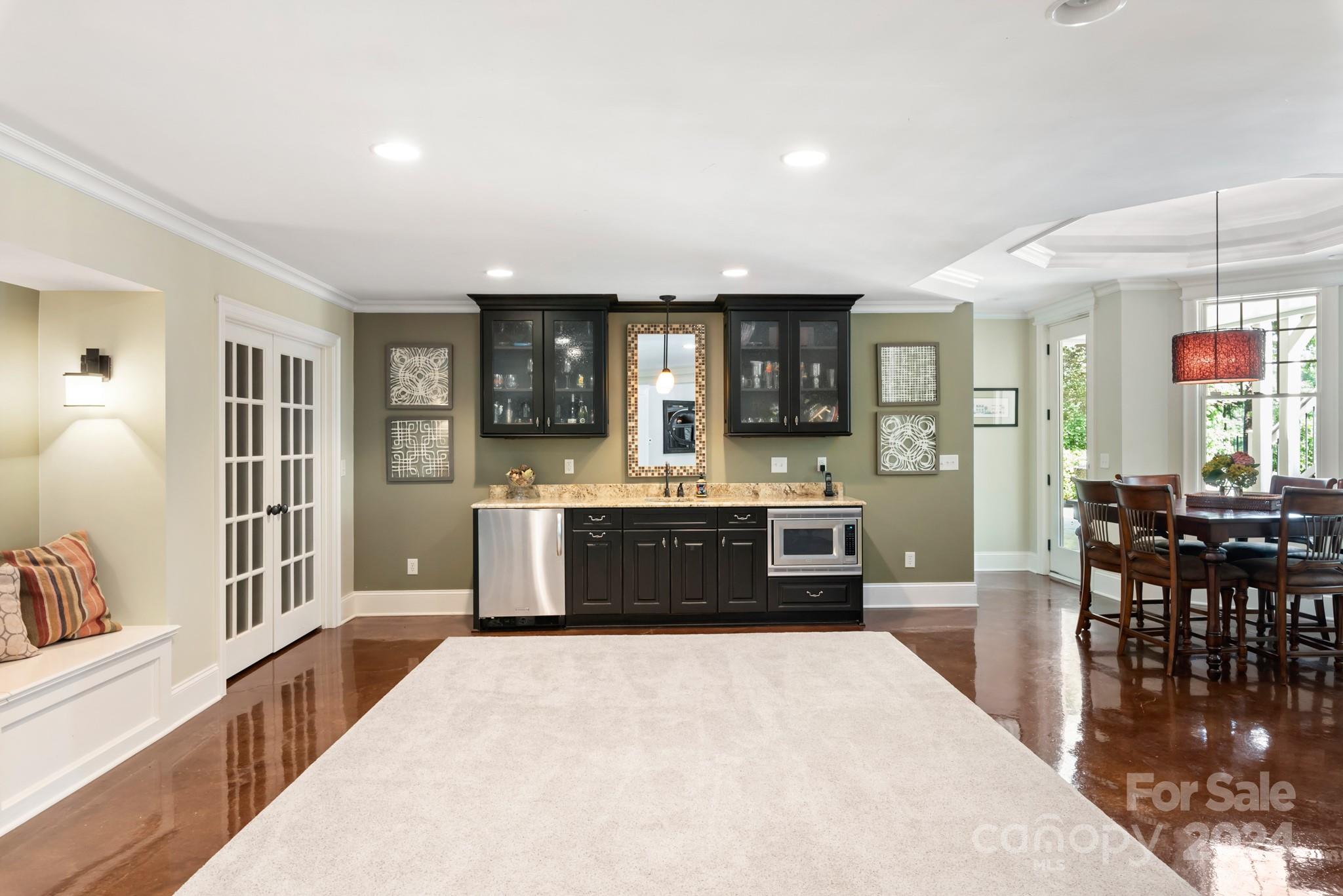 238 Horton Grove Road Fort Mill, SC 29715 - Photo 30 of 47 a large kitchen with kitchen island a sink table and chairs
